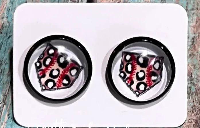 Round black stud earrings featuring patterned home plate with baseball stitching