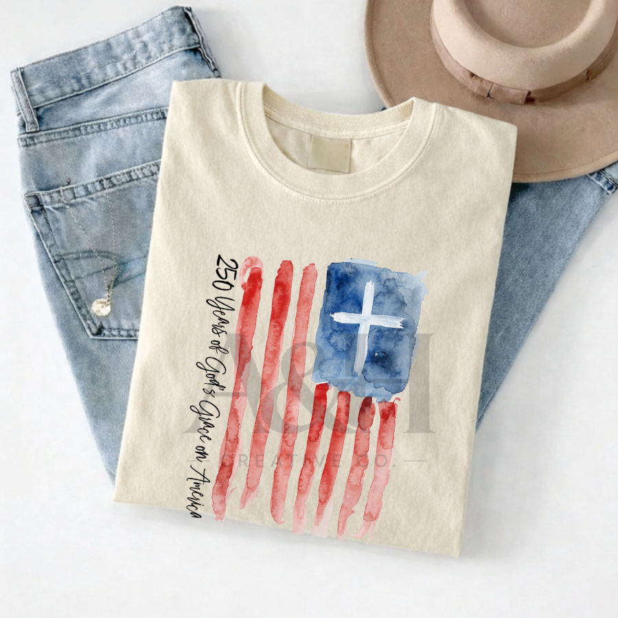 250 Years of God’s Grace on America | Watercolor Flag + Cross Unisex Tee