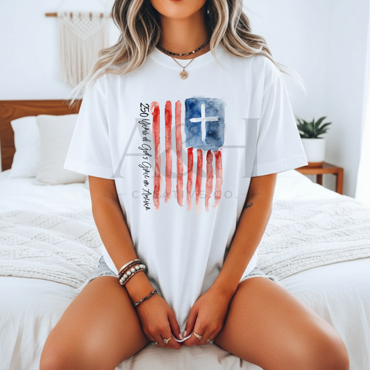 250 Years of God’s Grace on America | Watercolor Flag + Cross Unisex Tee