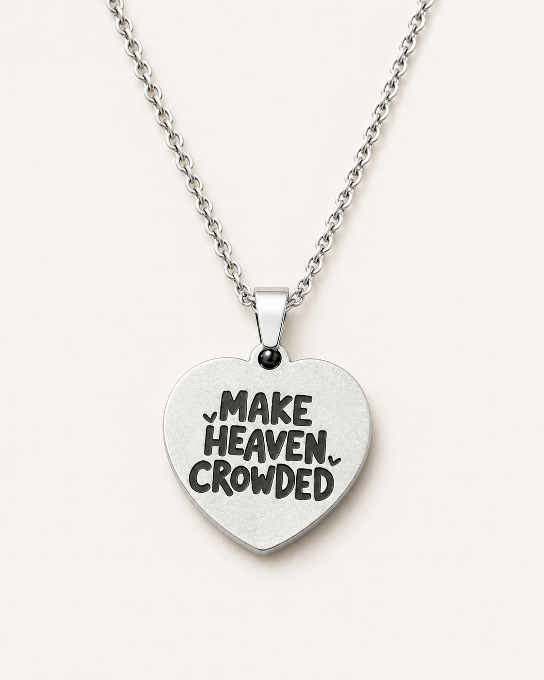 Silver heart-shaped Christian necklace engraved with the inspirational phrase "Make Heaven Crowded" on a polished pendant with a delicate chain.