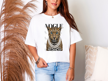 Woman wearing a white Leopard Vogue graphic tee featuring a fashionable leopard with blue eyes, layered pearl necklaces, and bold Vogue-inspired typography.