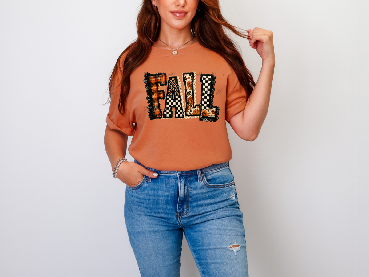 Woman wearing a burnt orange patchwork Fall graphic tee with mixed autumn patterns