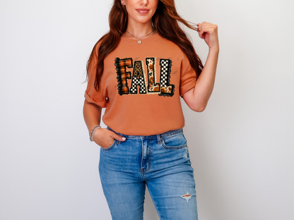 Woman wearing a burnt orange patchwork Fall graphic tee with mixed autumn patterns