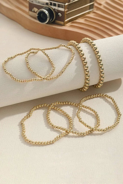 Gold stretch bracelet stack with coordinating round beaded bracelets